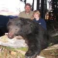 13 year old Howard with his first Bear, a very old boar.